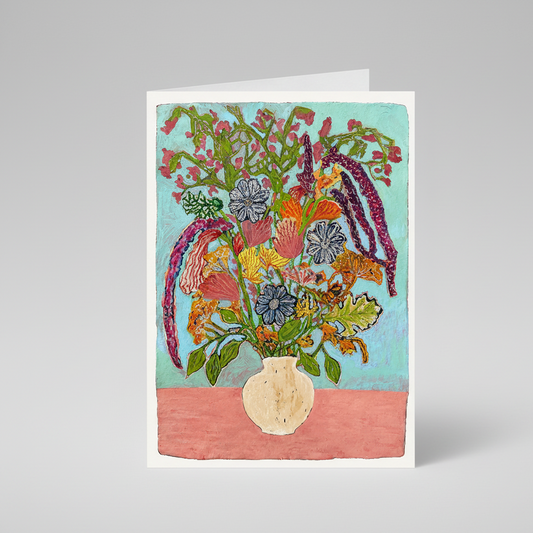 A square art print or card featuring a colorful still life painting of a flower bouquet in a cream-colored vase against a light blue background with a pink lower section.