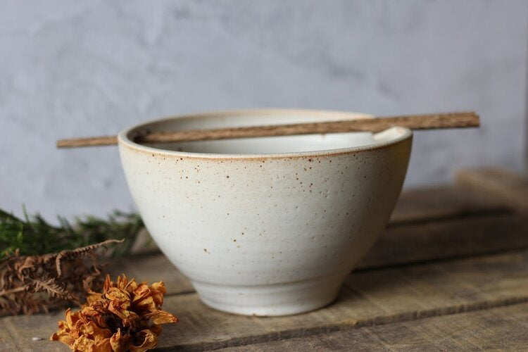 Speckled white Ramen bowl with chopsticks
